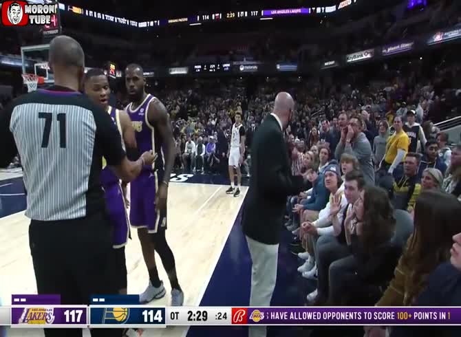 Video :When two fans jeer at Lebron James, he insists that they be sent out